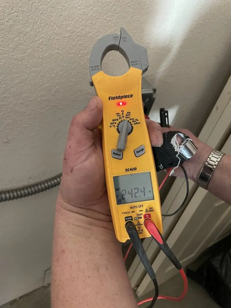 Voltage testing with clamp meter during Outlet Installation in Elizabeth City